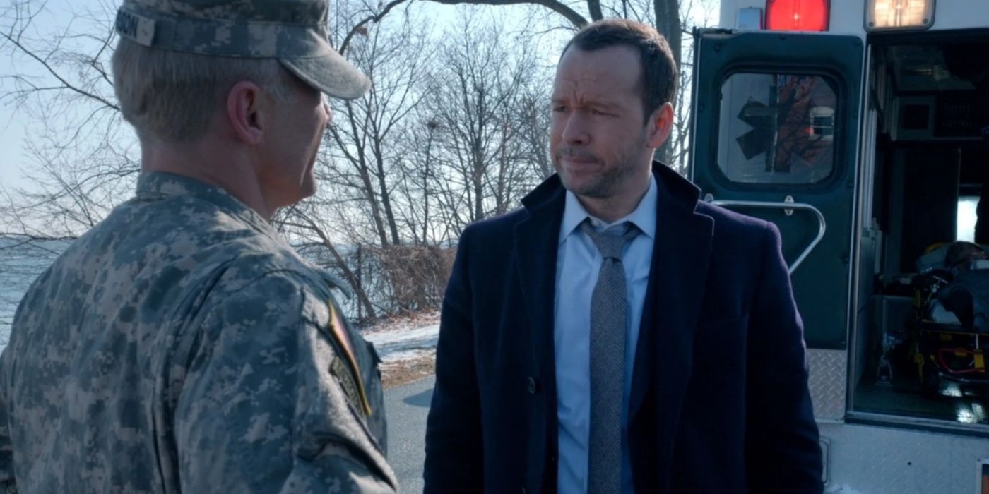 Danny looks at a solider with a resigned face in Blue Bloods