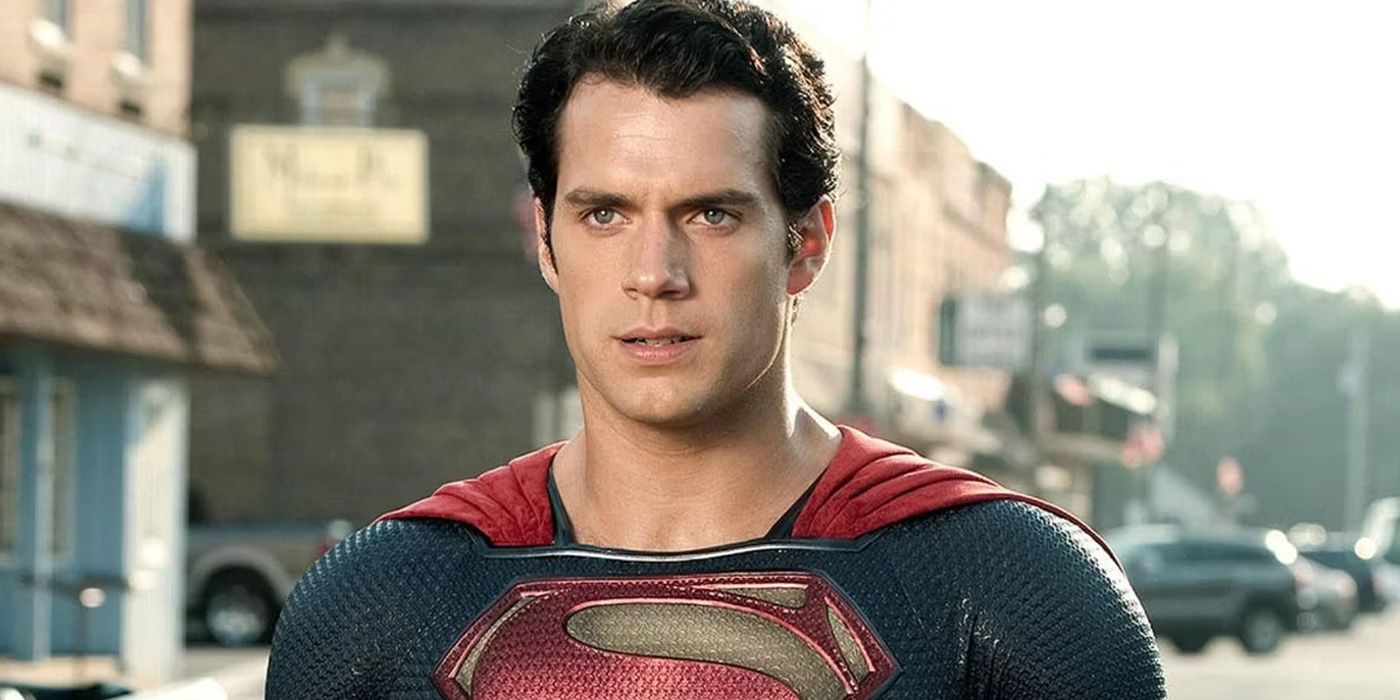 Superman, played by Henry Cavill, stands in the middle of the street in Man of Steel.