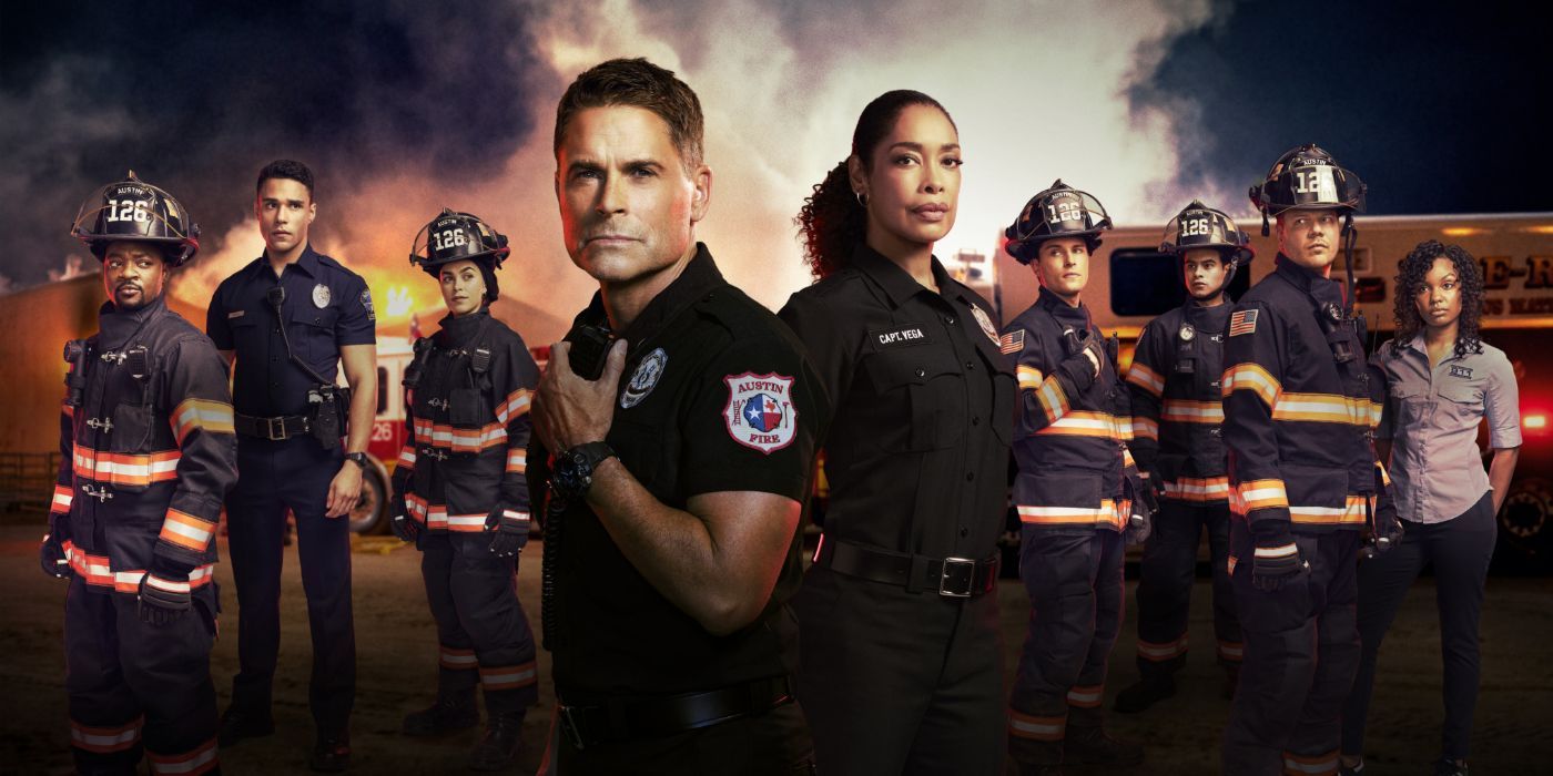The cast of 9-1-1: Lone Star stand in front of a burning building
