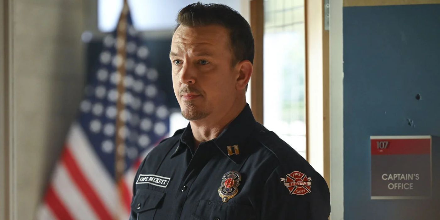 Sean Beckett standing in front of the Captain's office in Station 19