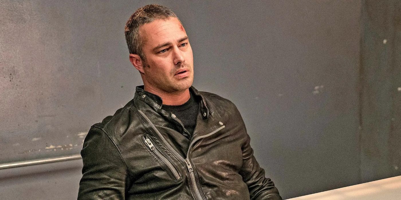 Kelly Severide (Taylor Kinney) sits in a chair and wears a leather jacket in Chicago Fire.