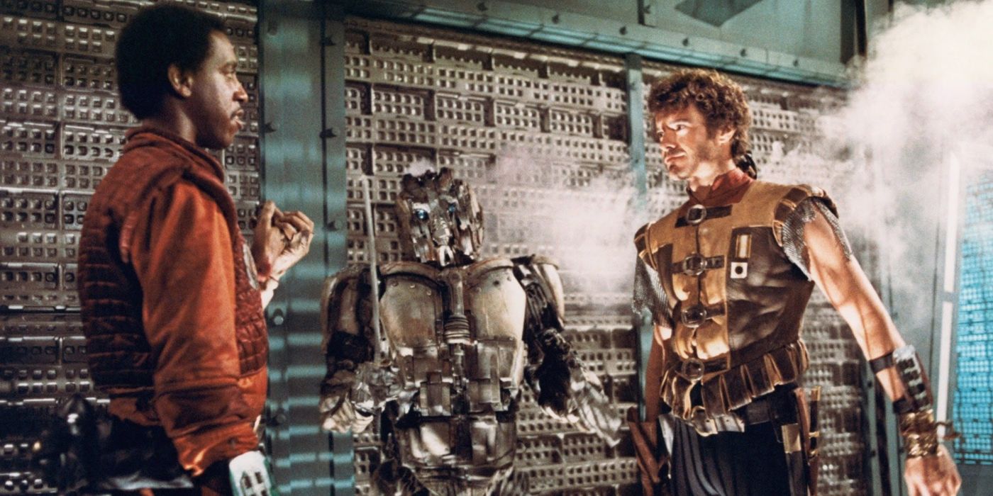 Jason and Roscoe in the movie Ice Pirates talking with a robot