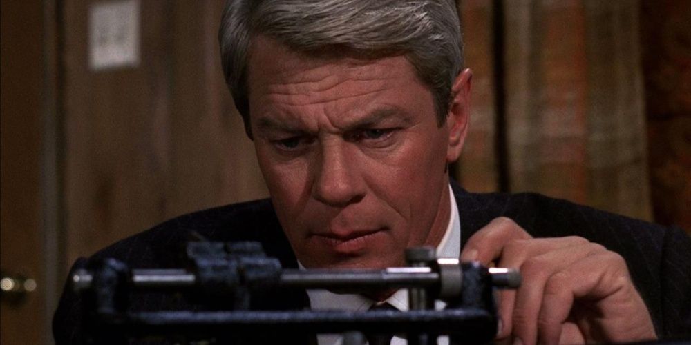 Jim Phelps examines a gadget in Mission Impossible (TV)