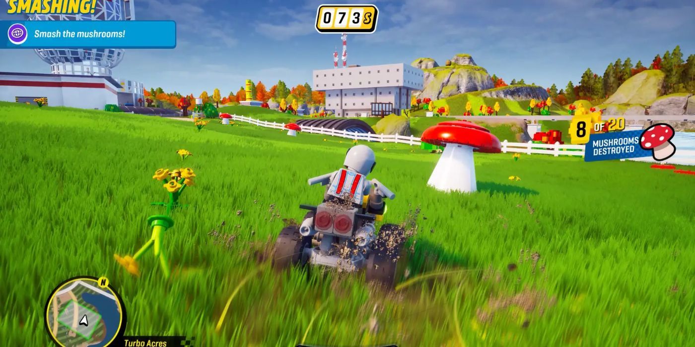 A player racer on an ATV driving across a field towards a track in LEGO 2K Drive