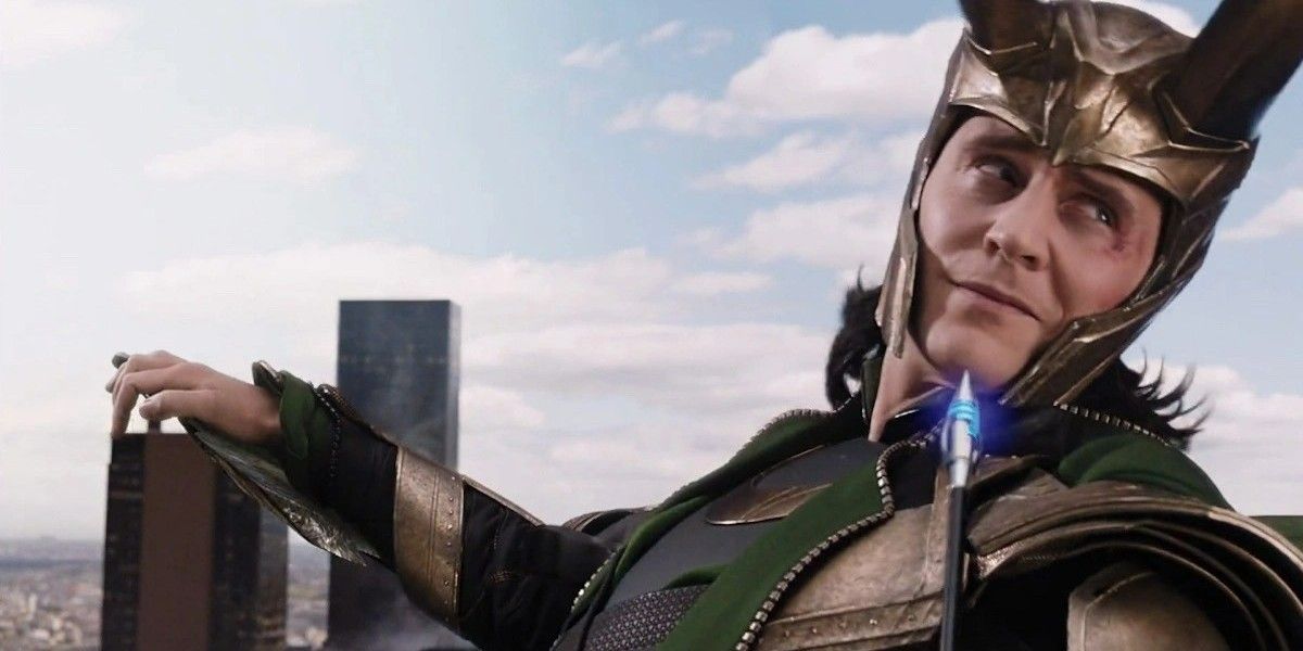 Loki (Tom Hiddleston) looking over his shoulder with a grin in the MCU