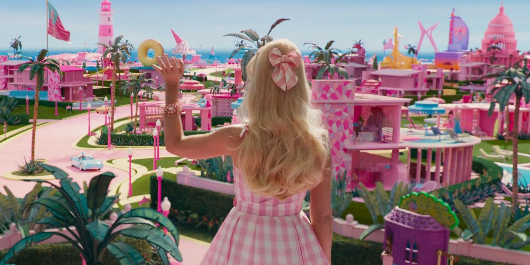 Margot Robbie's Barbie waves hello to the rest of Barbieland