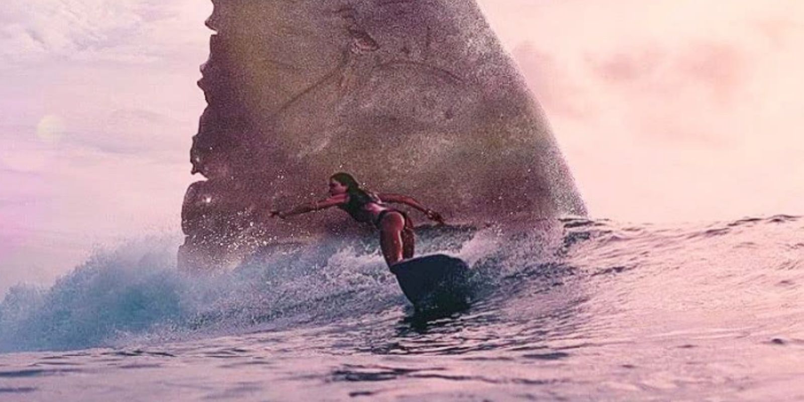 A woman surfing in Meg 2: The Trench trailer.