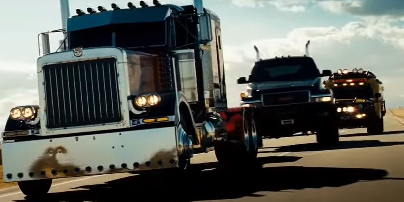 Optimus Prime Ratchet and Ironhide driving down the road in Transformers