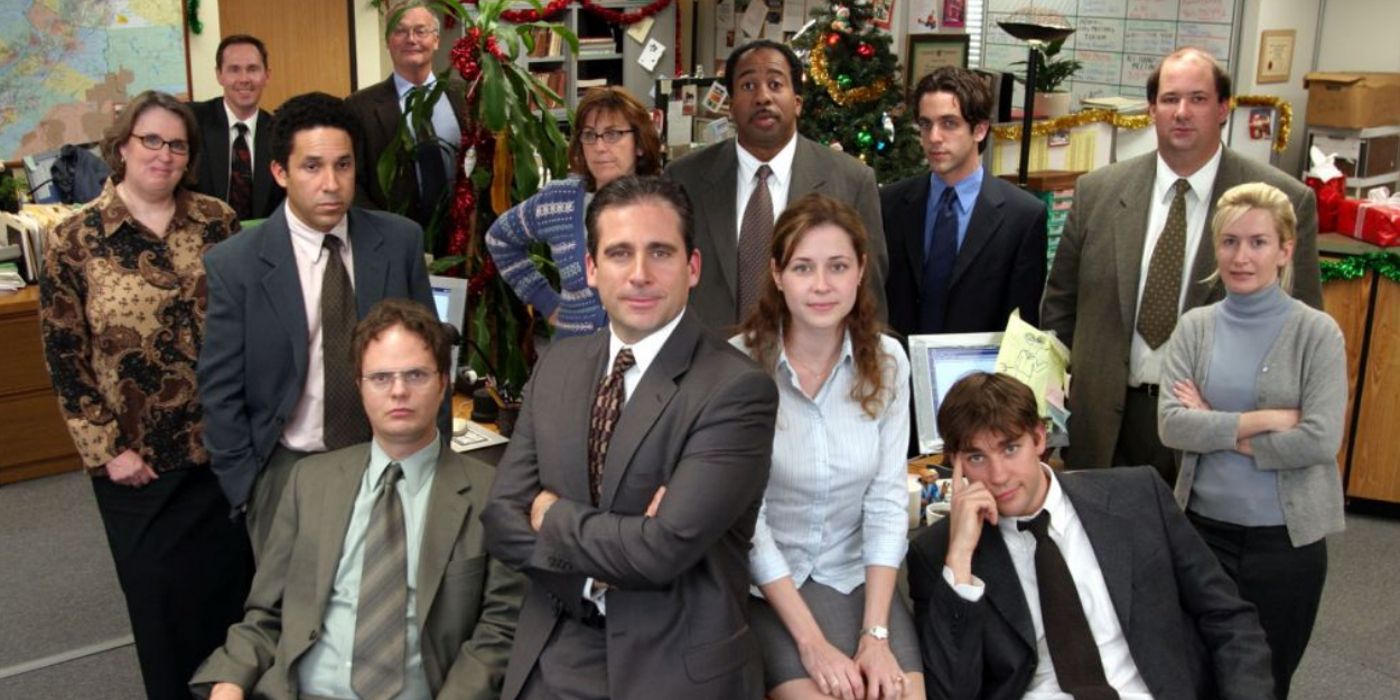 The cast of The Office poses for a workplace photo