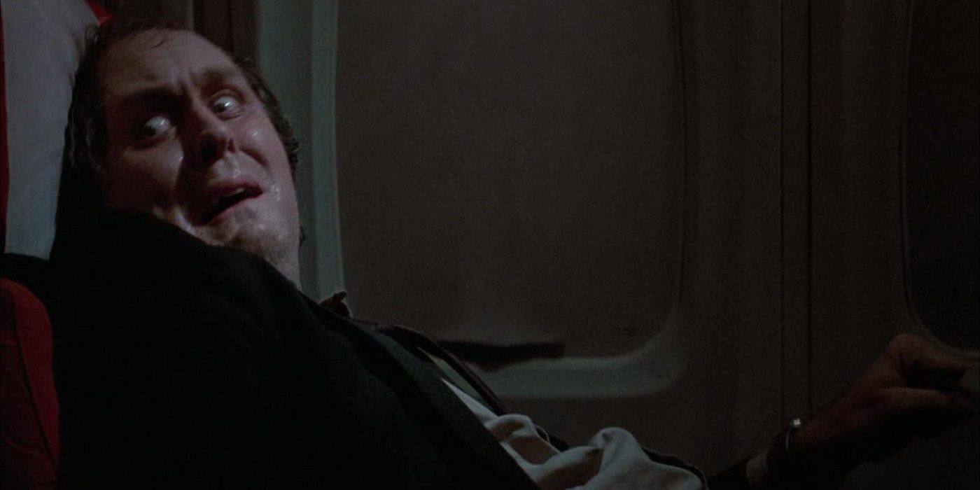 John Lithgow's John Valentine looking distressed on a plane in Twilight Zone: The Movie.
