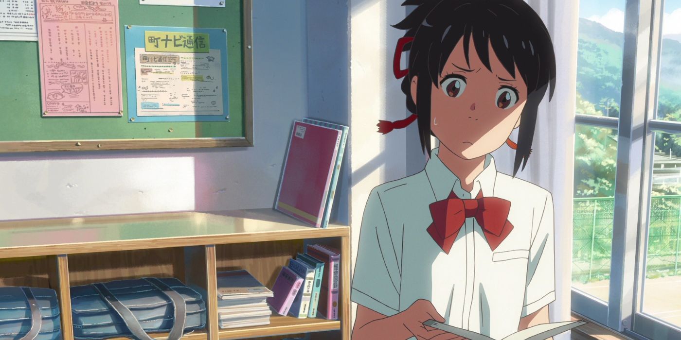 Mitsuha Miyamizu looking concerned while reading in her hometown from Your Name. 