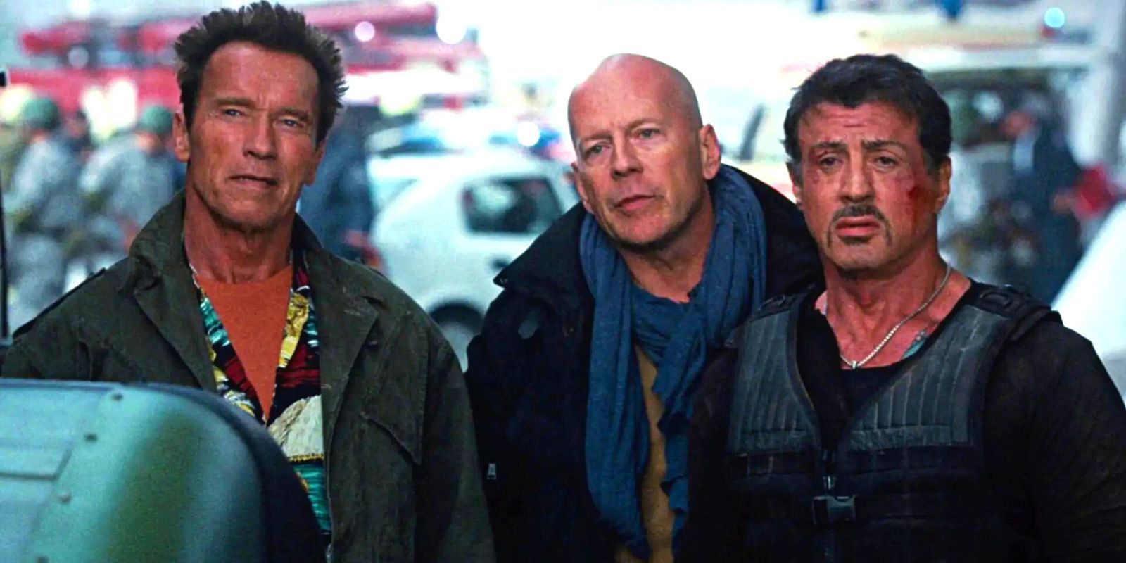 Arnold Schwarzenegger, Bruce Willis and Sylvester Stallone looking confused