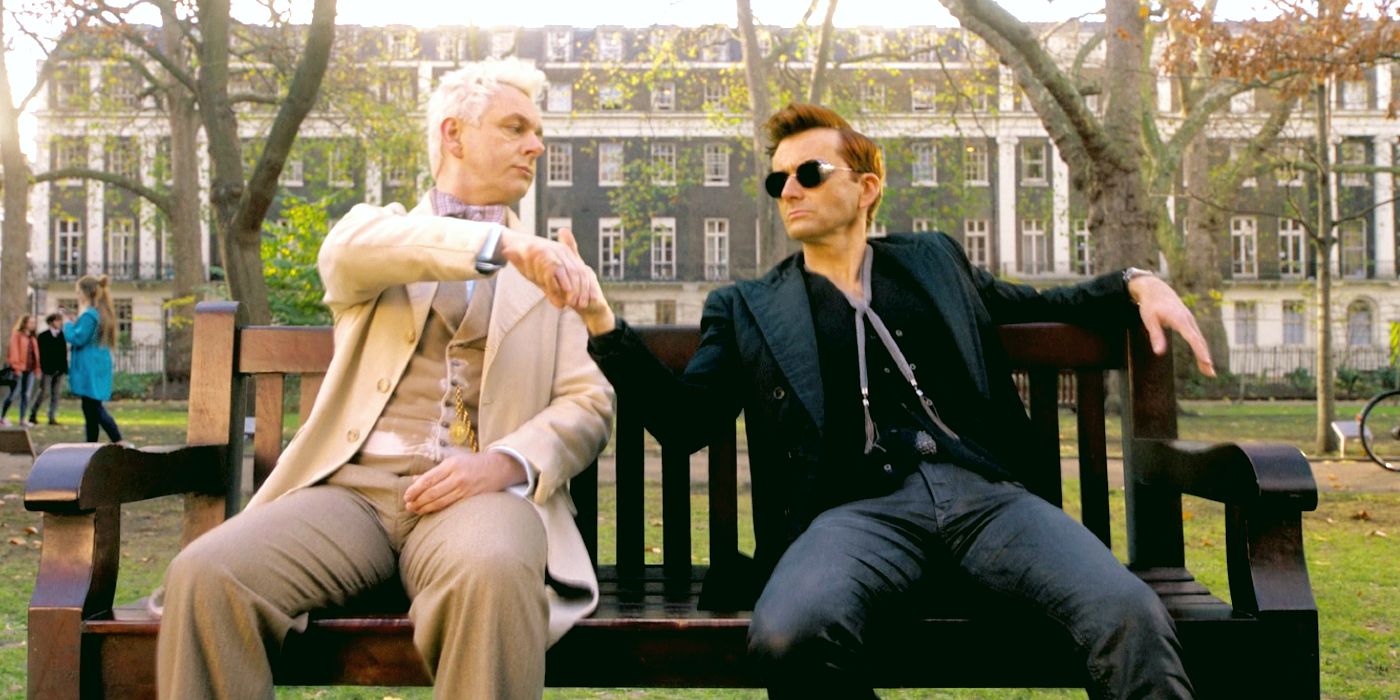 Michael Sheen's Aziraphale and David Tennant's Crowley sit on a bench in Good Omens.