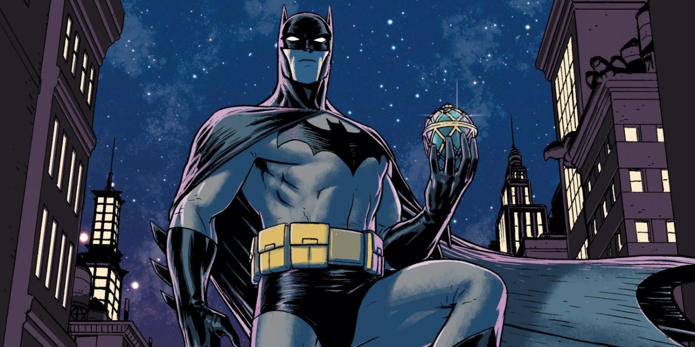 Batman holding the mysterious jeweled egg in cover art for Universe.