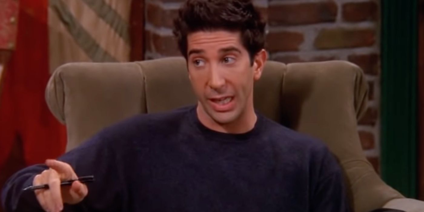 Ross Geller señala mientras está sentado en una silla de Central Perk en Friends