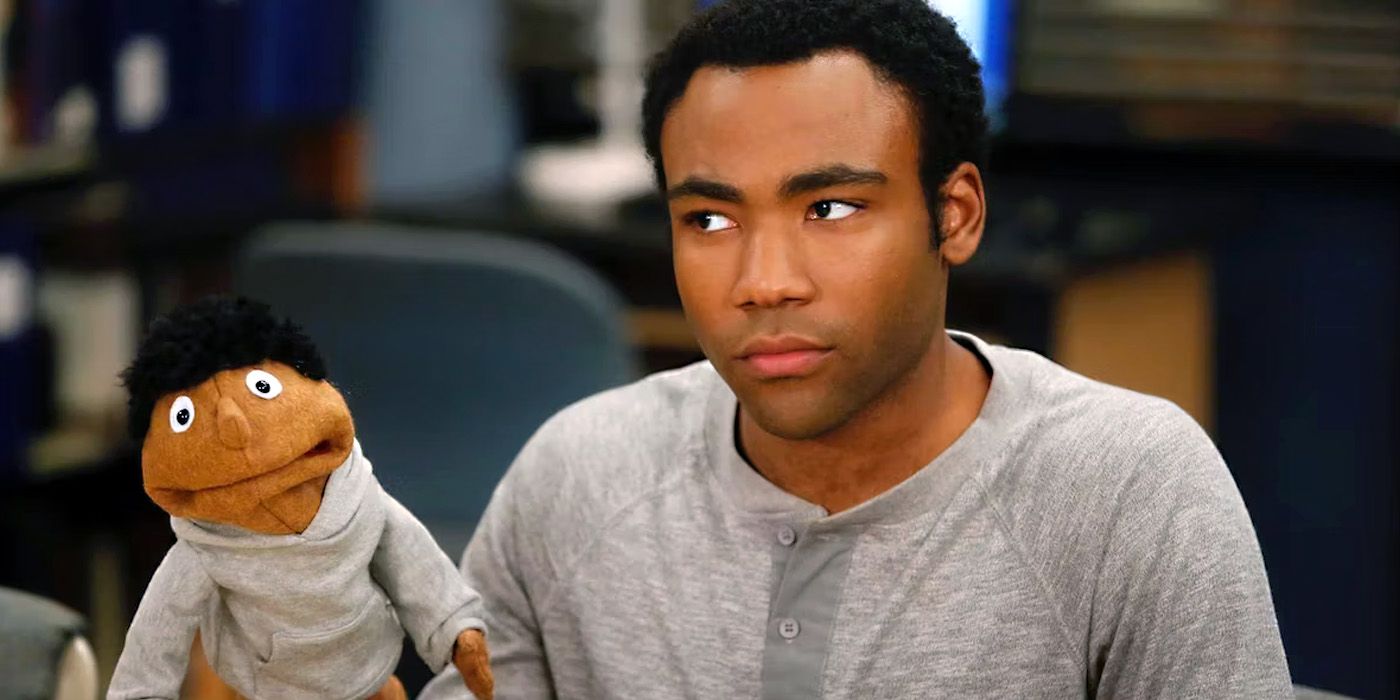 Donald Glover as Troy Barnes, with his Troy puppet, in Community.