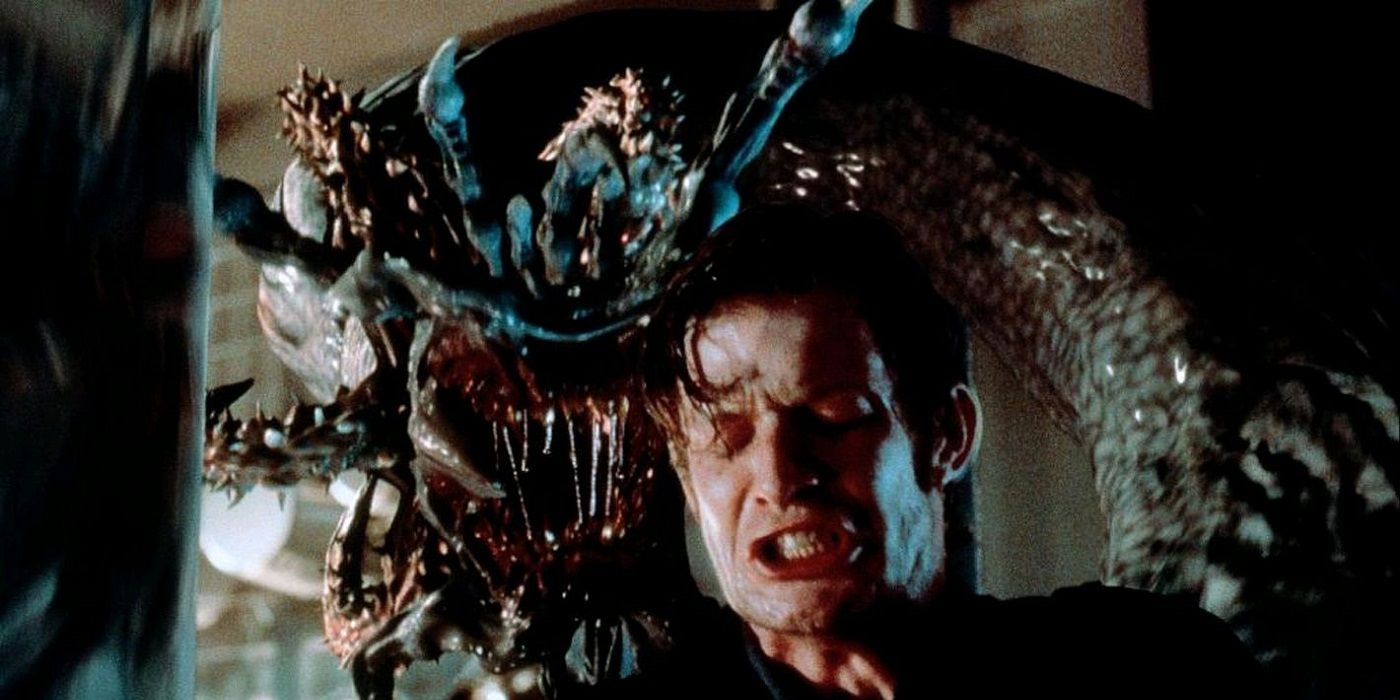 Jason Flemyng with a monster lurking behind him in Deep Rising