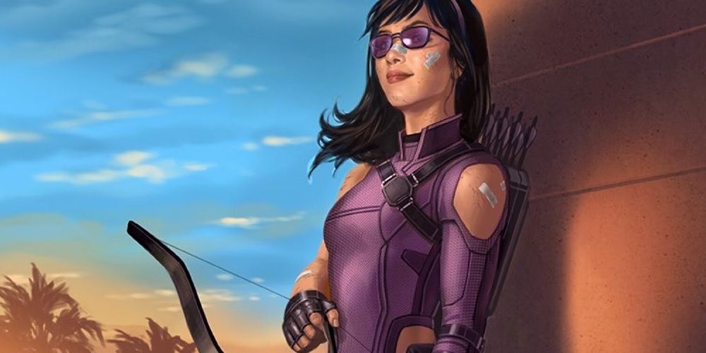 Kate Bishop in her purple Hawkeye outfit with several injuries covered by band-aids and medical tape. She is holding her bow, the string pulled back with her other hand.