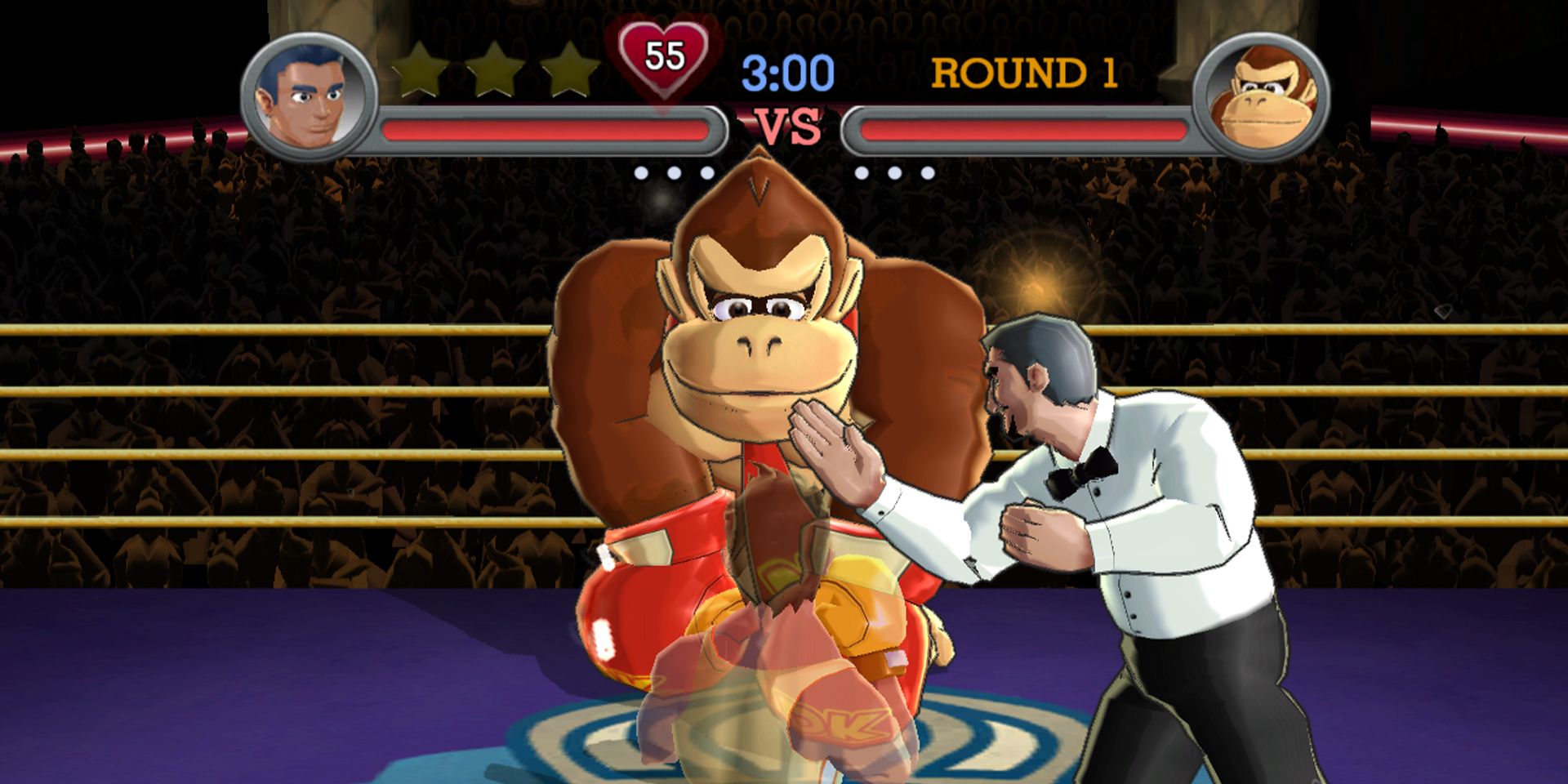 Little Mac joga as mãos com Donkey Kong em Punch-Out!!  Wii