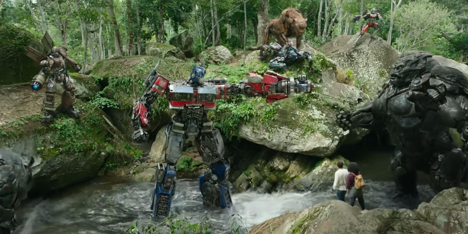 Autobots and humans in a river in Transformers Rise of the beasts.
