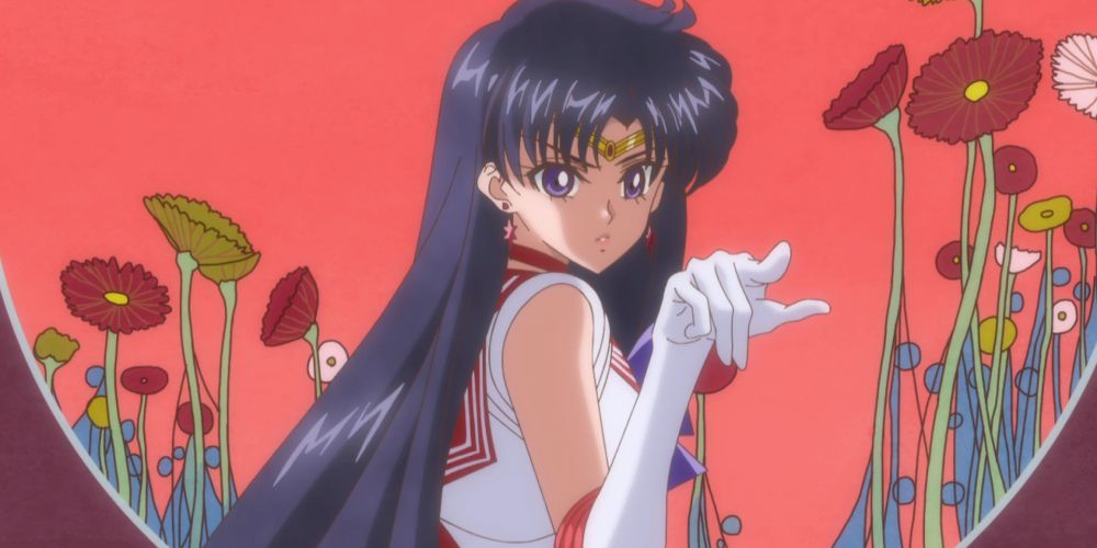 Sailor Mars em sua sequência de transformação, cercada por papoulas em Sailor Moon Crystal