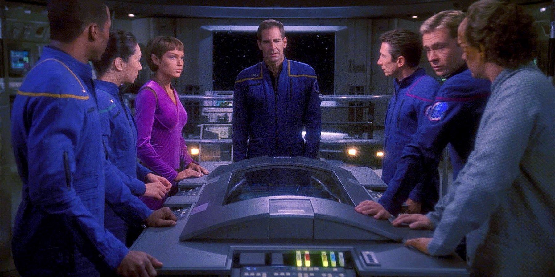 Star Trek Enterprise crew standing around the bridge computer