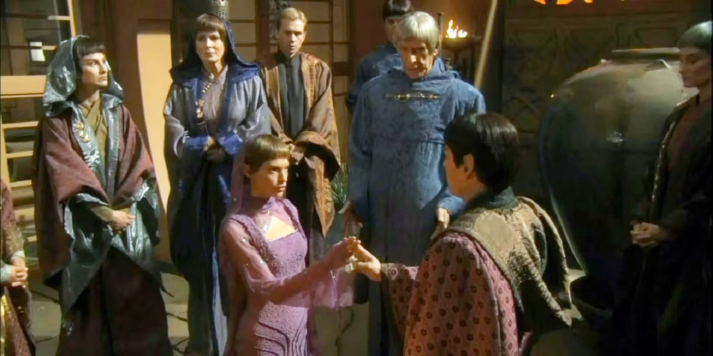 A group of Vulcans surrounding T'Pol during her marriage ceremony to Koss on Star Trek Enterprise