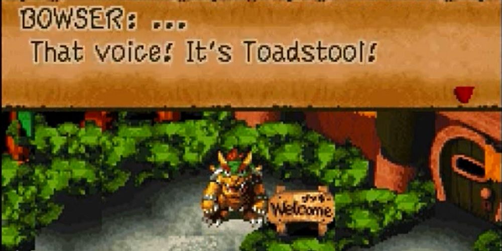 Bowser parado ao lado de uma placa de boas-vindas em Super Mario RPG