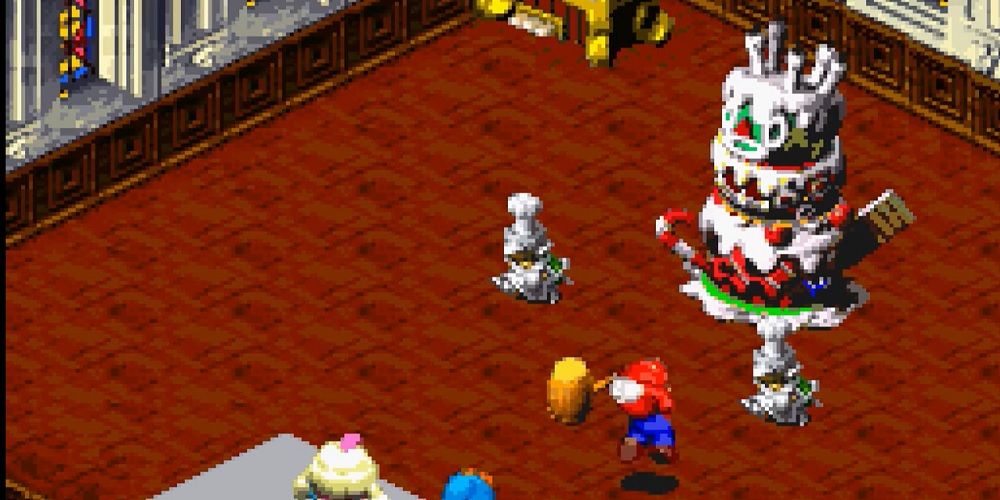 Super Mario RPG chefe Bundt e seus capangas lutando contra Mario que está atacando com seu martelo