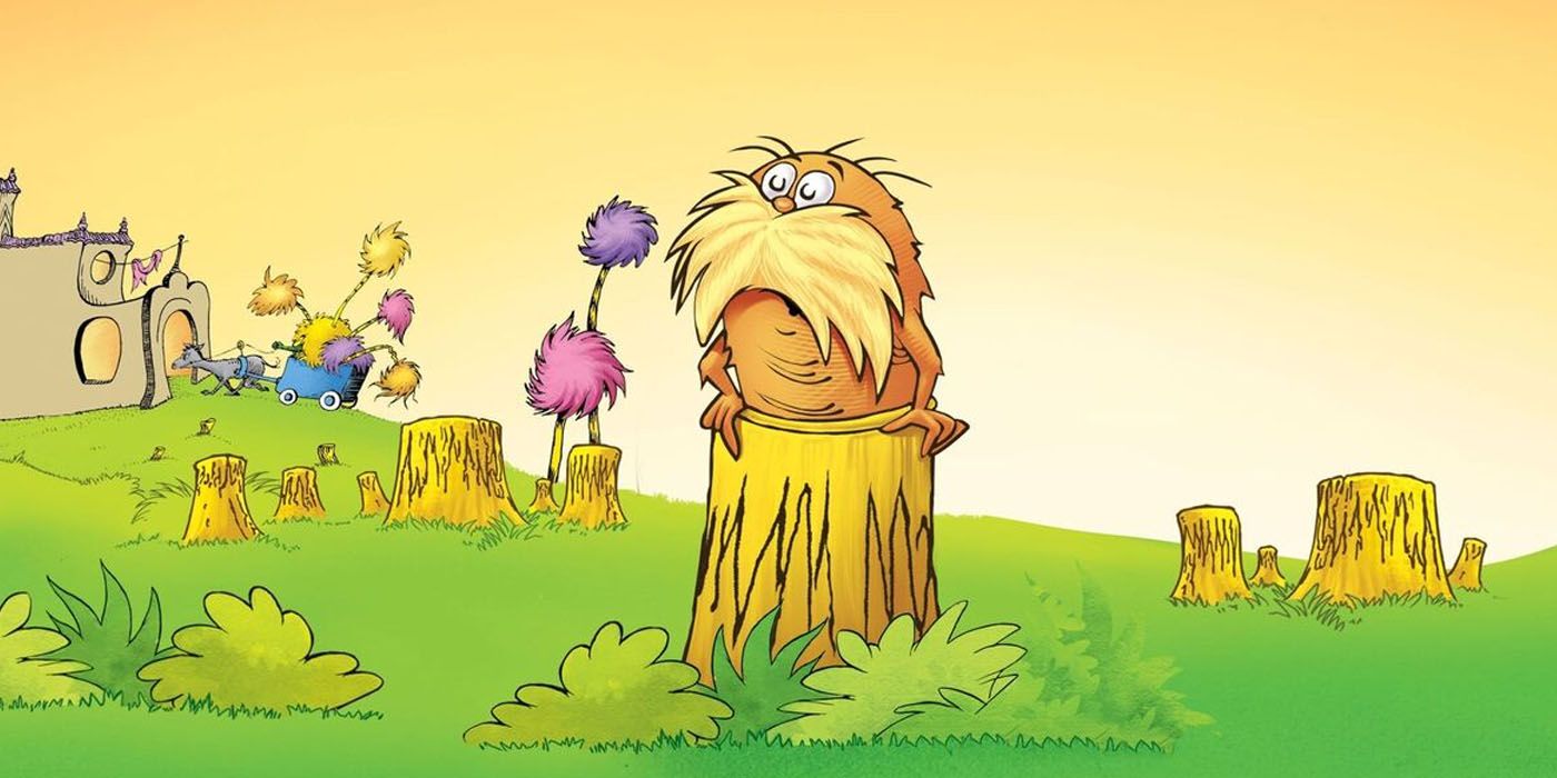   Lorax do Dr. Seuss fica no topo de um toco de árvore em uma floresta dizimada.