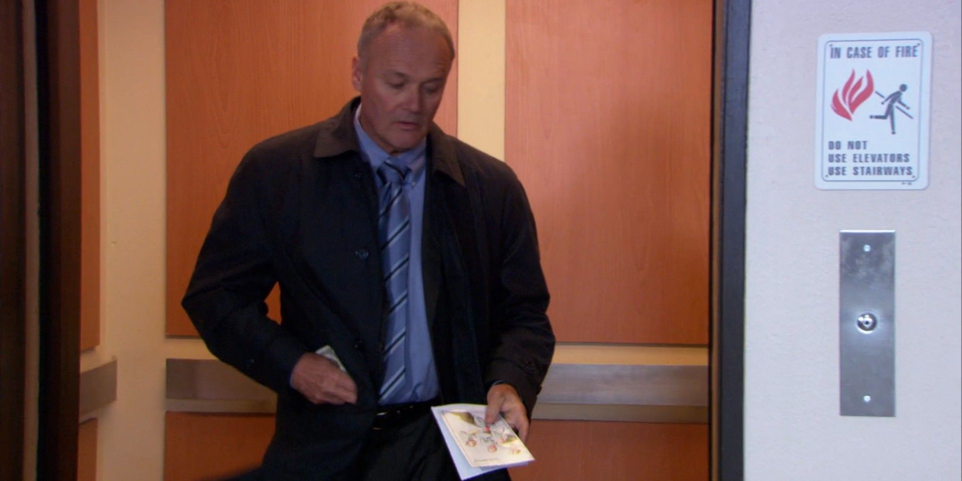 Creed steals Debbie's money and tosses her card in The Office.