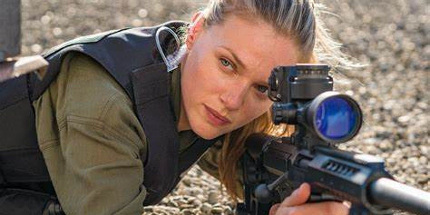 Hailey Upton in a Kevlar vest aiming her sniper rifle at a target in Chicago PD