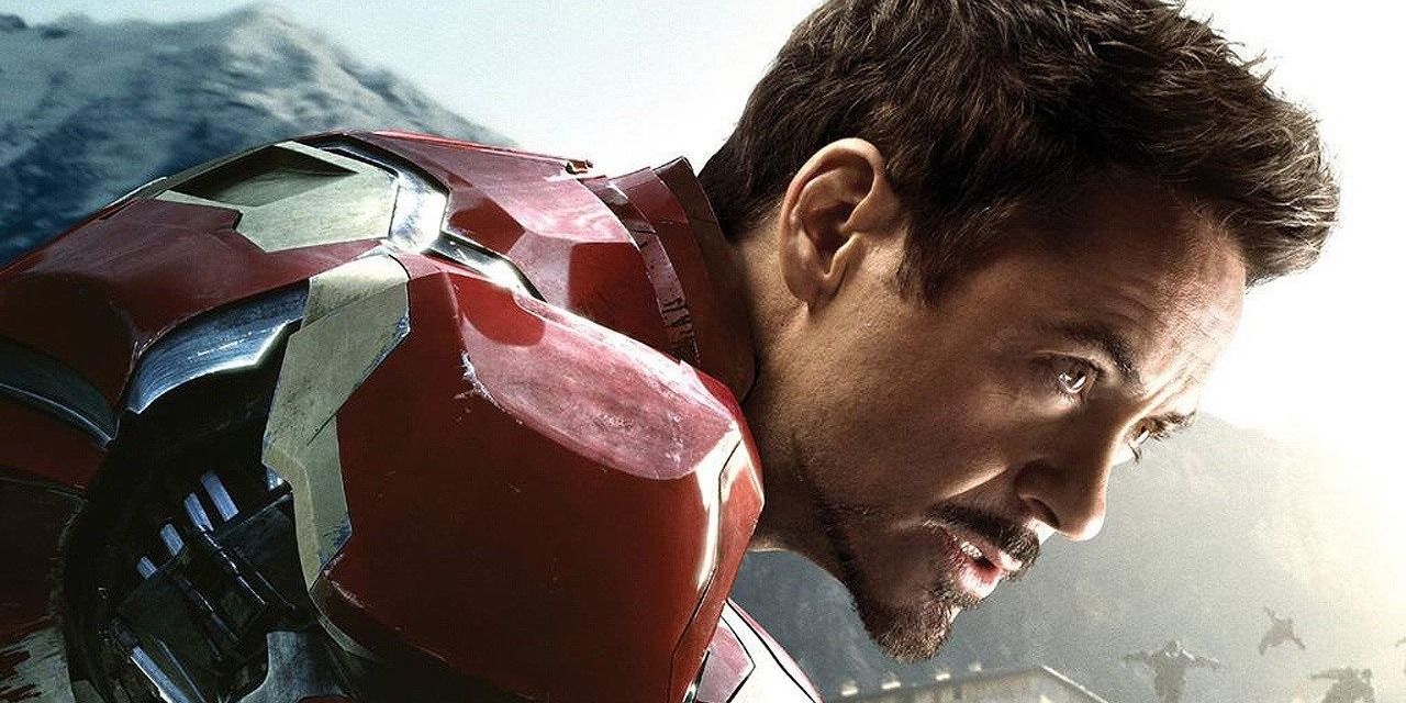 Close up of Tony Stark unmasked in Iron Man armor crouching
