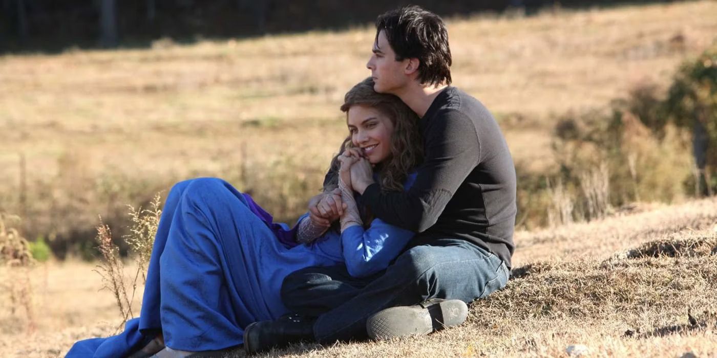 Damon hugs Rose in a field in The Vampire Diaries