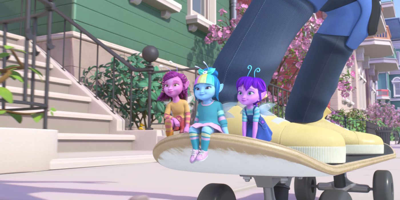 A Still from Dew Drop Diaries. From left: Phoebe, Athena and Eden hitch a ride on a kid's skateboard through the city.