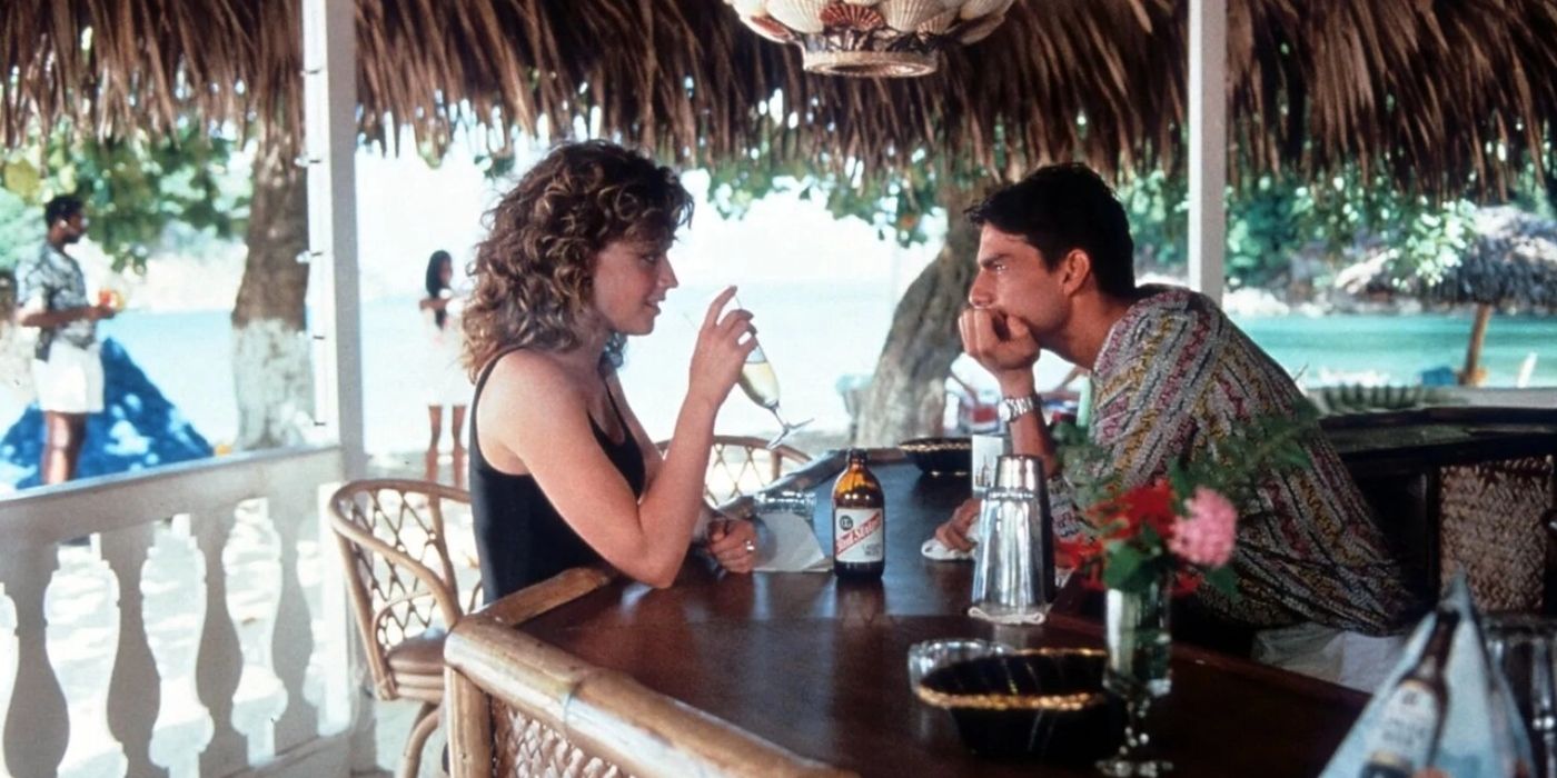 Elizabeth Shue and Tom Cruise talk at a bar in Cocktail
