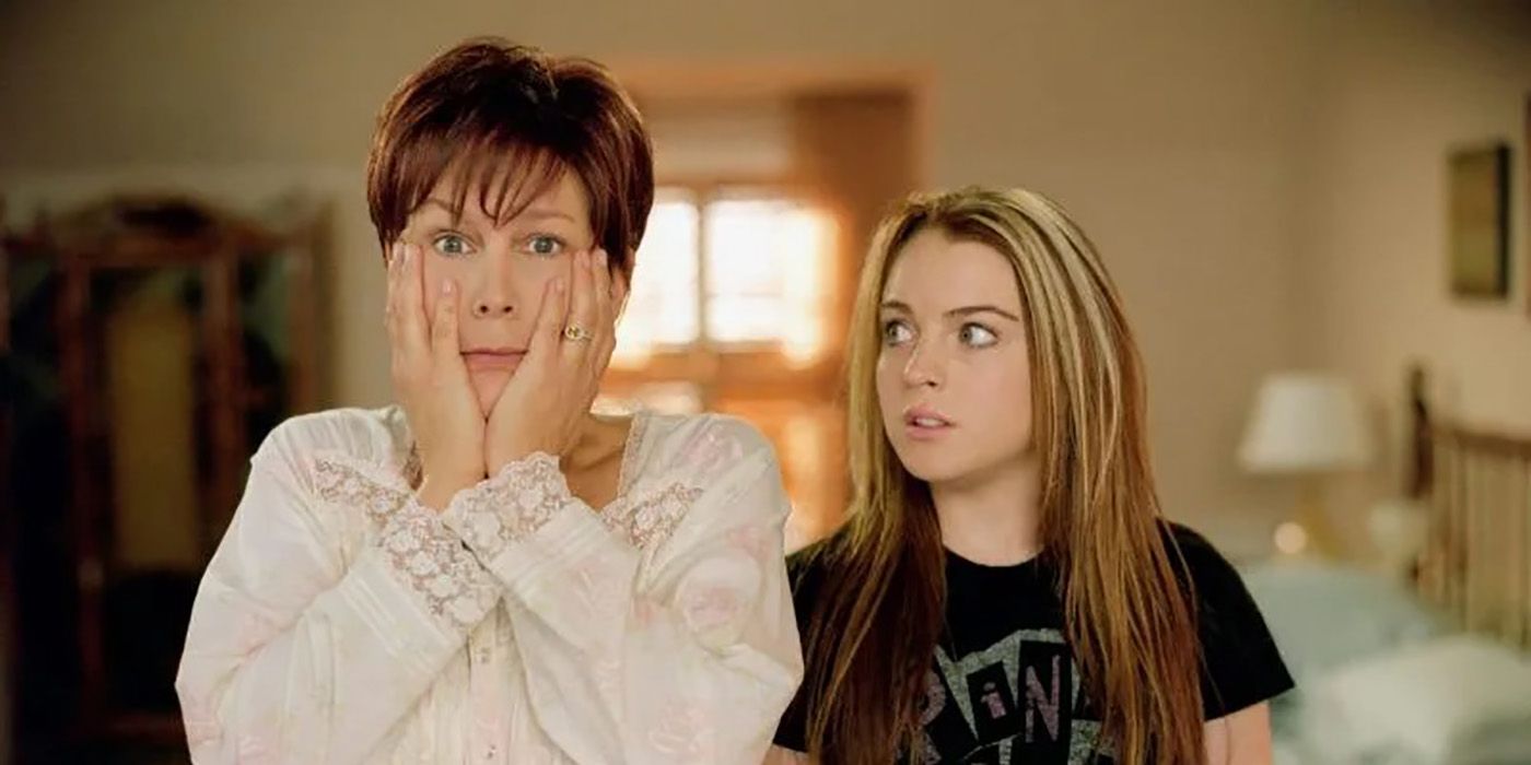 Jamie Lee Curtis with her hands on her cheeks looking surprised, Lindsay Lohan looking at her in a scene from Freaky Friday.