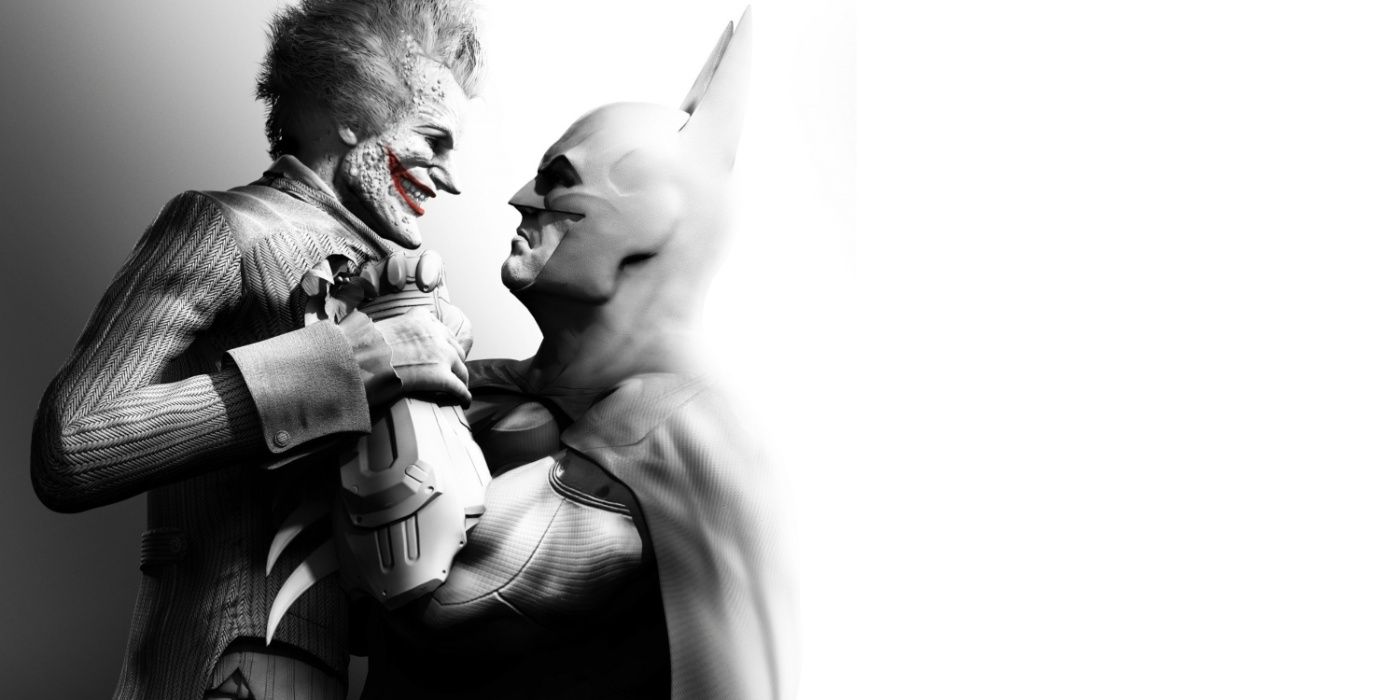 Arkham City key art featuring Joker being held up and interrogated by Batman.