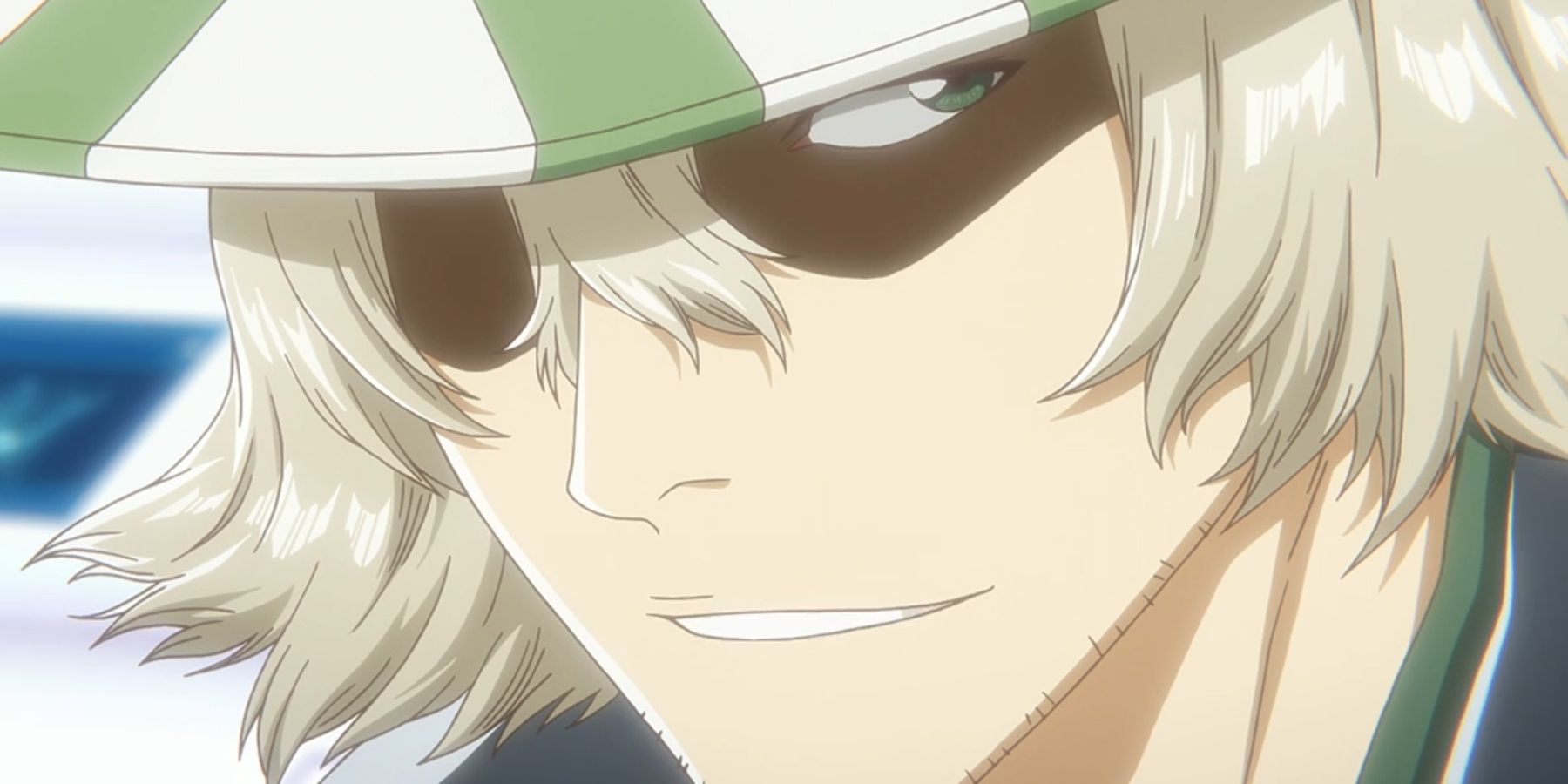 Kisuke Urahara grins in Bleach anime.
