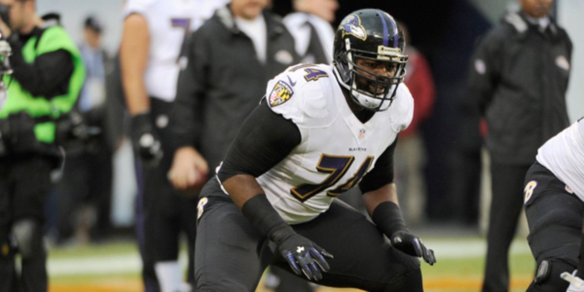 Michael Oher readying to make a block while a member of the Baltimore Ravens