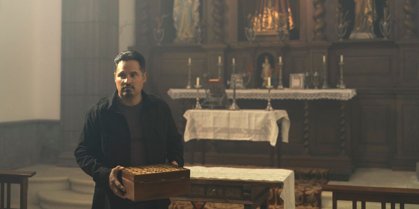 Michael Pena's Domingo Chavez holds a box in a church during Jack Ryan Season 4