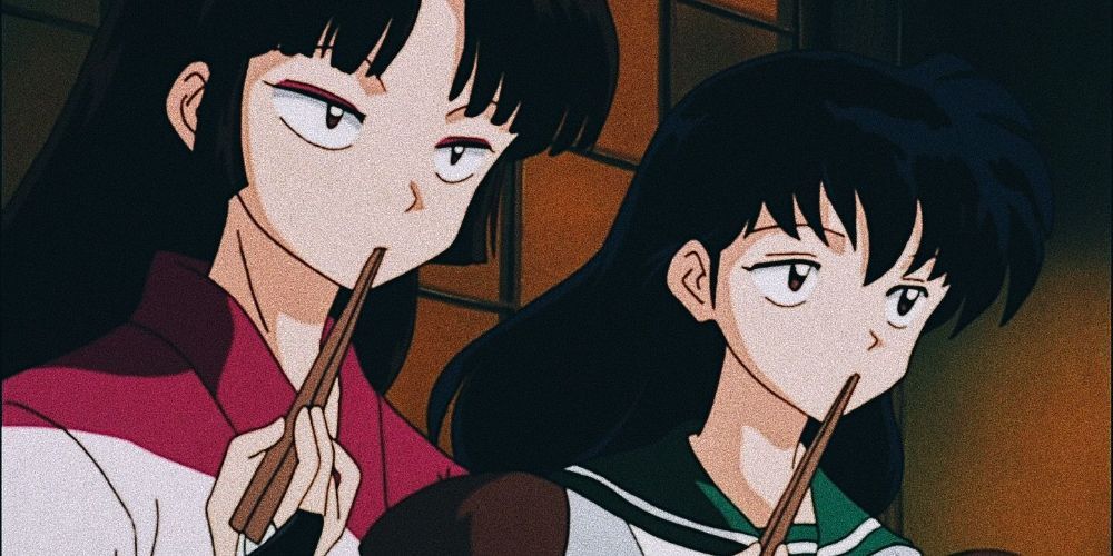 Sango and Kagome eating food and looking dubious in InuYasha