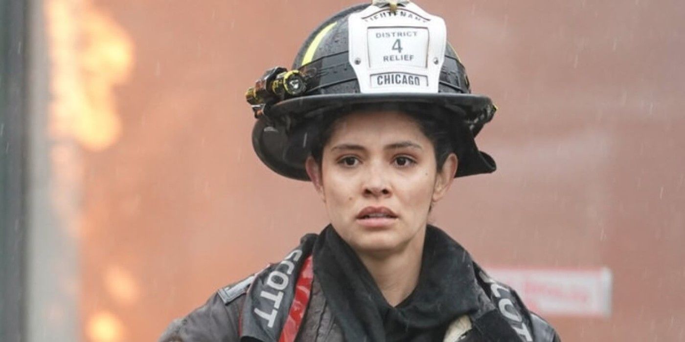 Stella Kidd wears her firefighter uniform and gazes toward the camera in concern in Chicago Fire