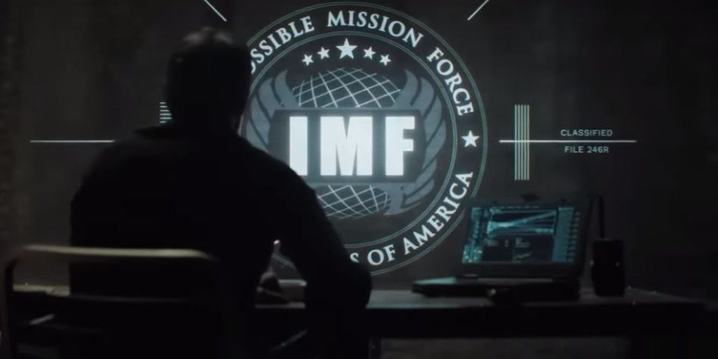 The camera faces Ethan's back as he watches the mission briefing in Mission_ Impossible, Fallout