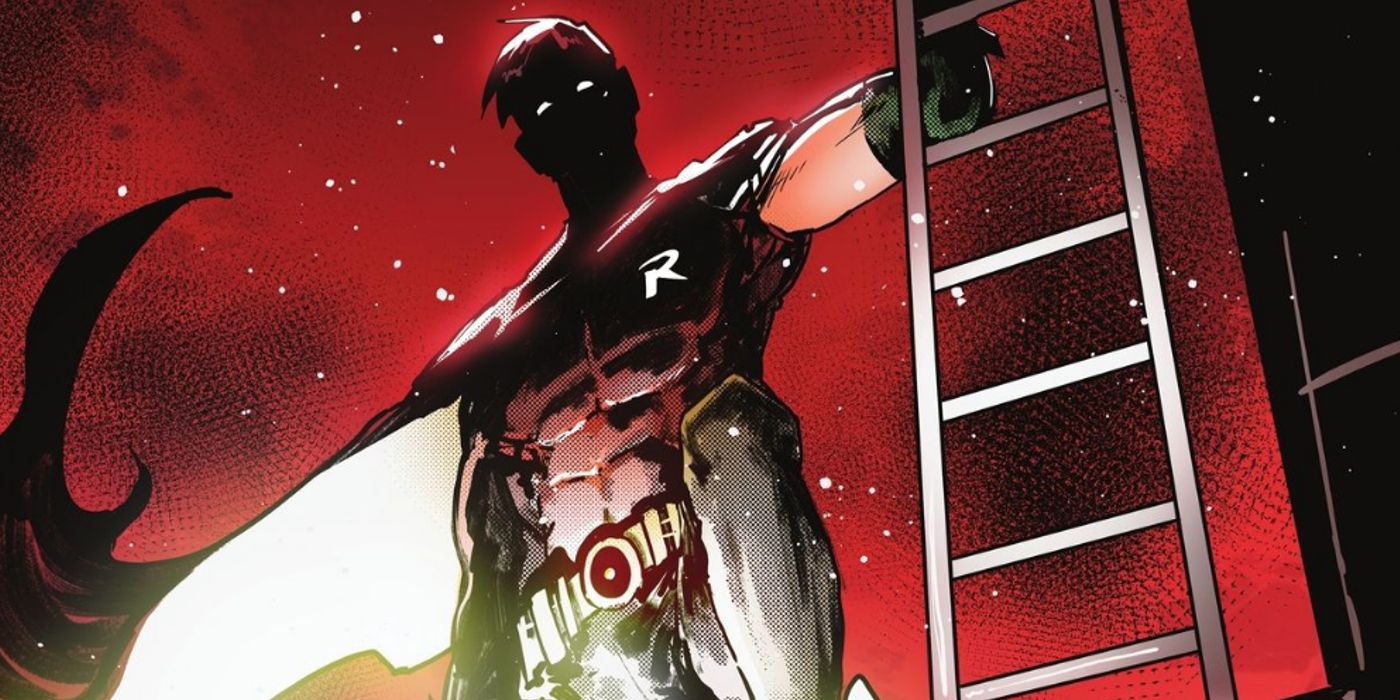 tim drake in his robin costume standing next to a fire escape against a crimson-lit night sky