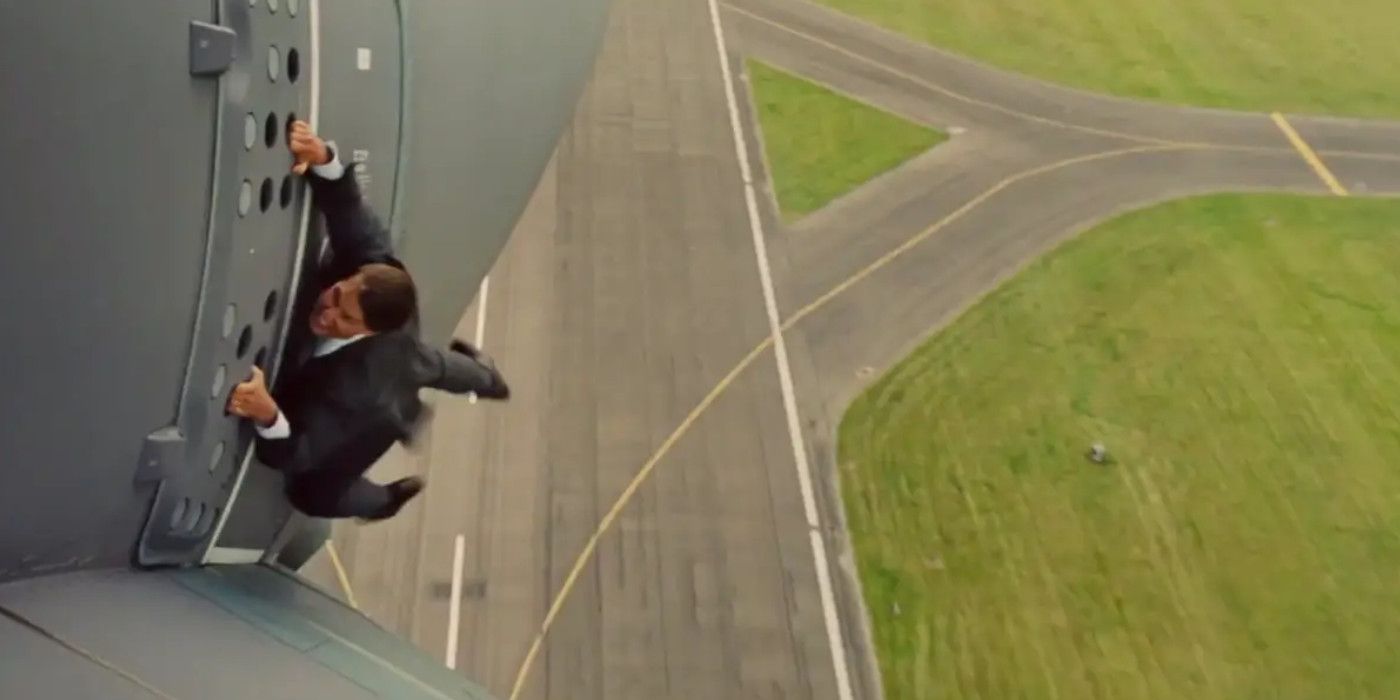 Tom Cruise hangs onto a plane in Rogue Nation.