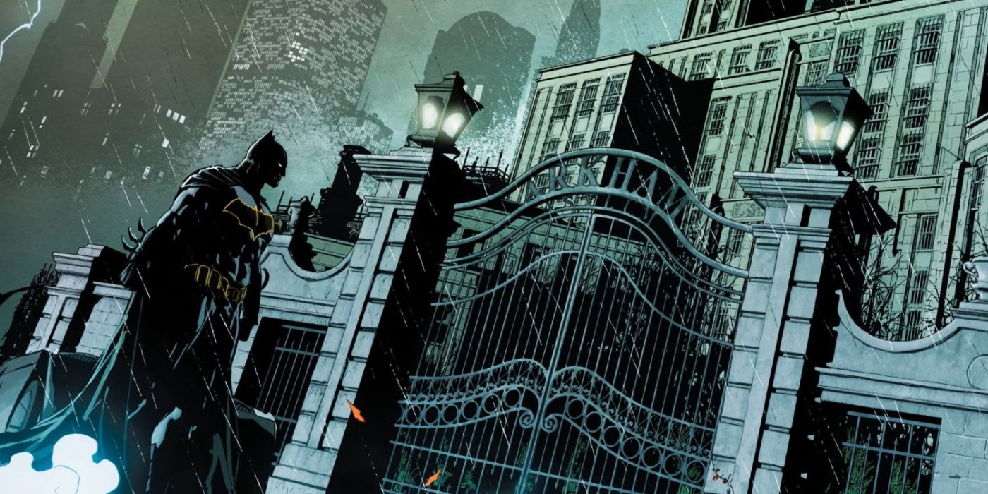 Batman standing outside the gates of Arkham Asylum in DC Comics.