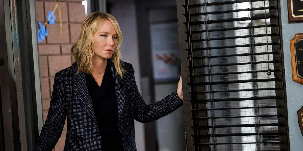 Amanda Rollins, played by Kelli Giddish, stands in a doorway on Law & Order: SVU