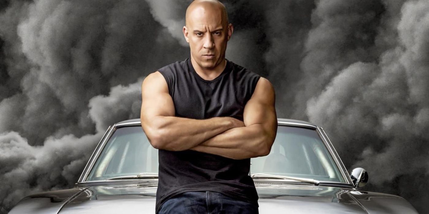 Dominic Toretto (Vin Diesel) crosses his arms in front of his car in F9
