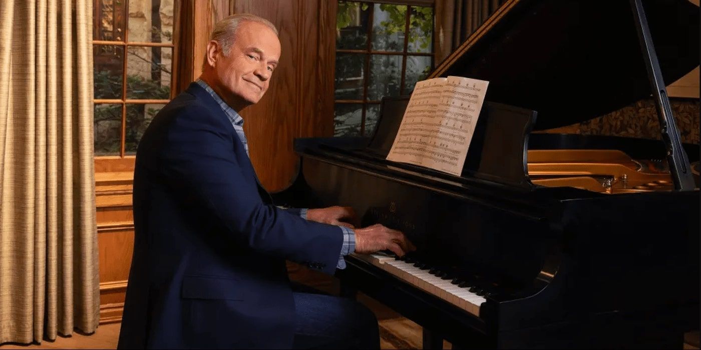 Kelsey Grammer's Frasier sits by a piano and smiles to the camera